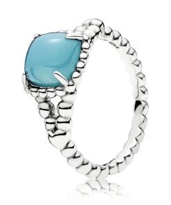 Silver ring with scuba blue crystal