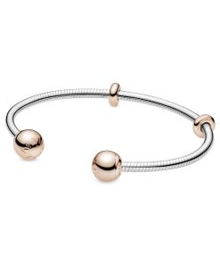 Sterling silver open bangle with 14k Rose Gold-plated silicone stoppers and interchangeable end caps