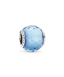 Abstract silver charm with faceted sky blue crystal