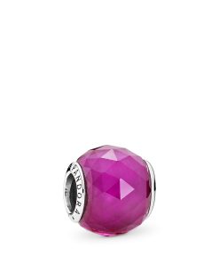 Abstract silver charm with faceted synthetic ruby