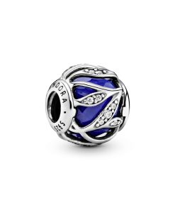 Abstract silver charm with faceted royal blue crystal and clear cubic zirconia