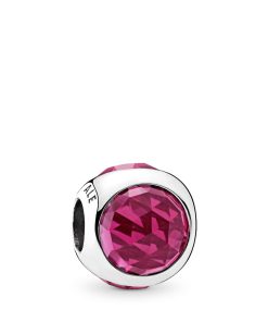Silver charm with cerise crystal